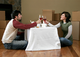 Couple having thier first meal in thier new appartment